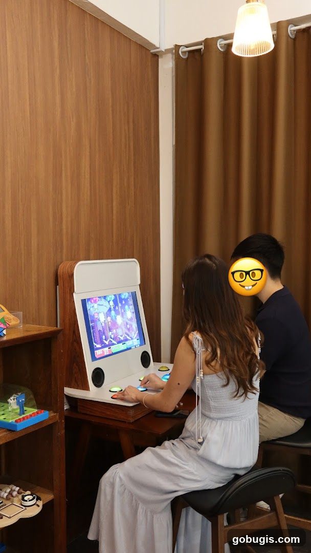 People playing arcade game