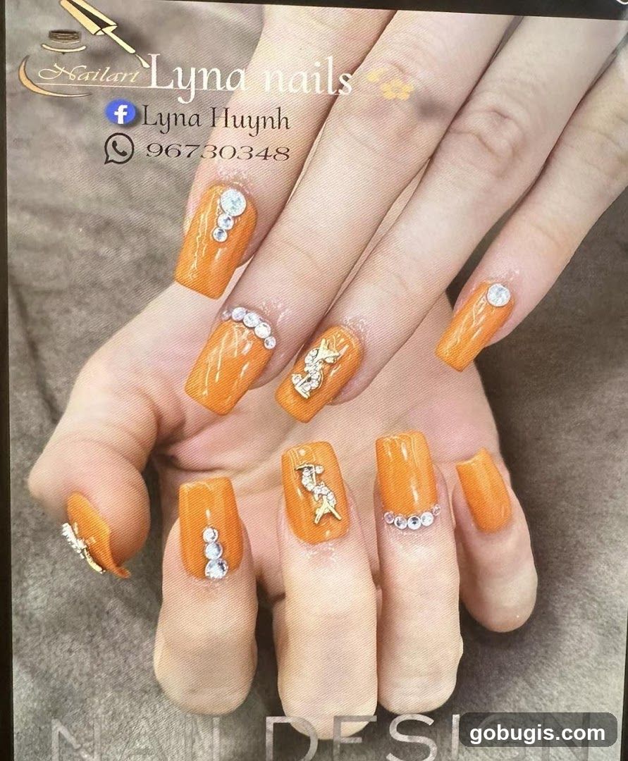 Orange Nails with Embellishments