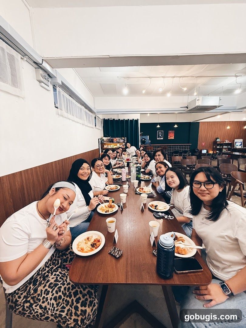 Group of people dining at a long table