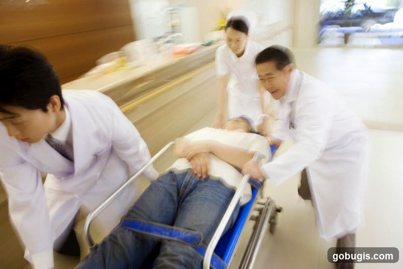 Medical professionals rushing a patient
