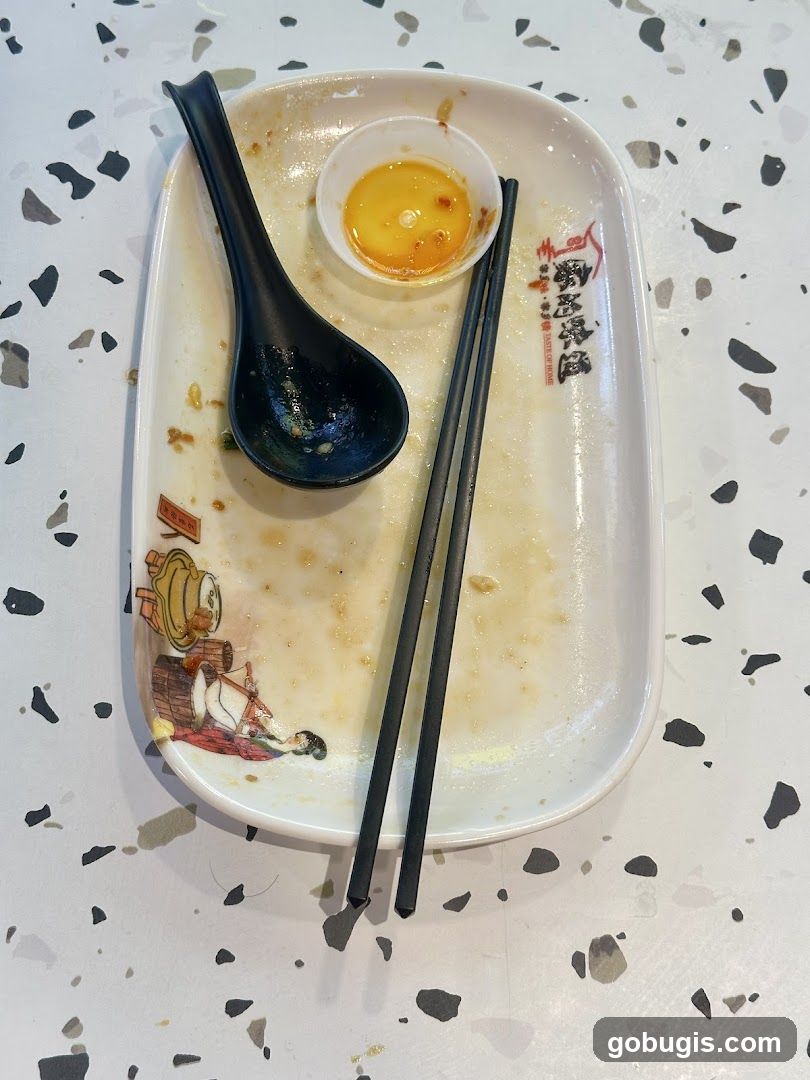 Dirty Plate with Chopsticks and Spoon