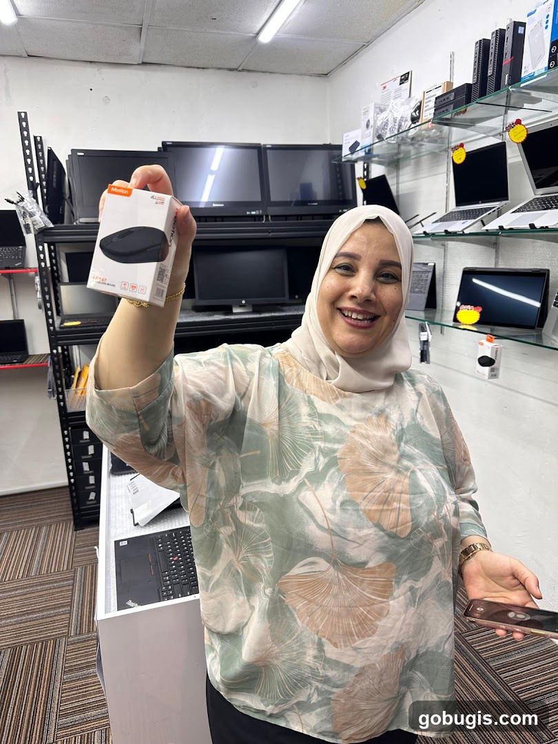 Woman holding a computer mouse box