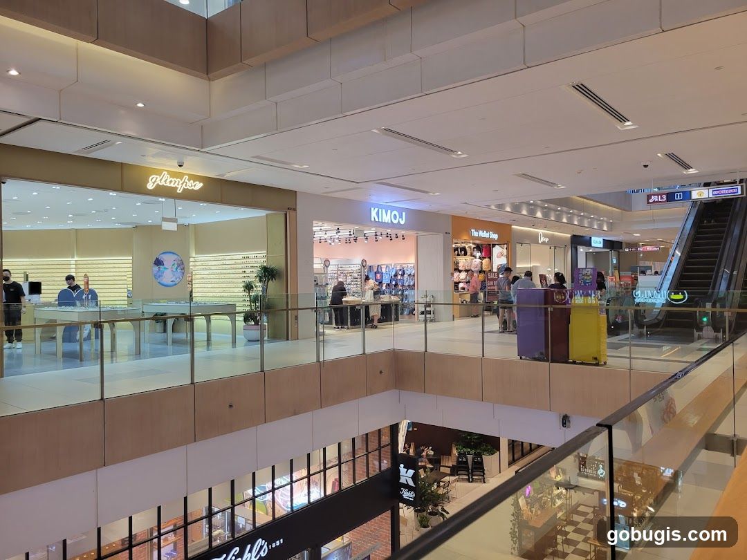 Mall Interior with Shops and Escalator