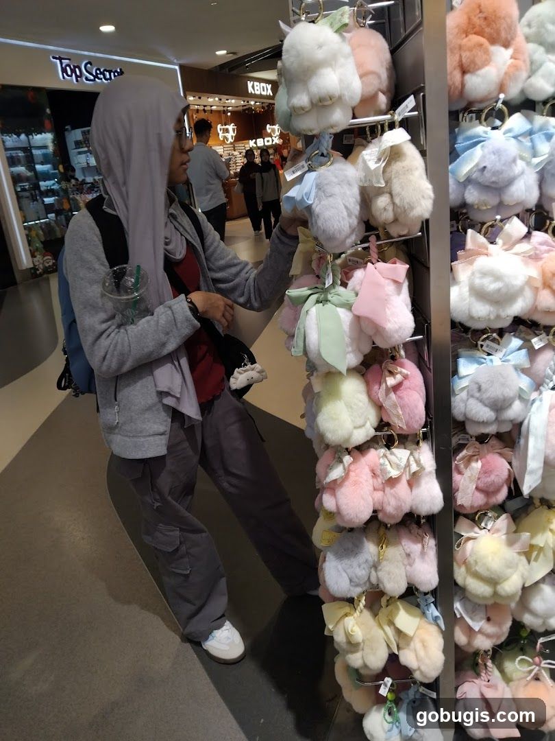 Woman browsing fluffy keychains