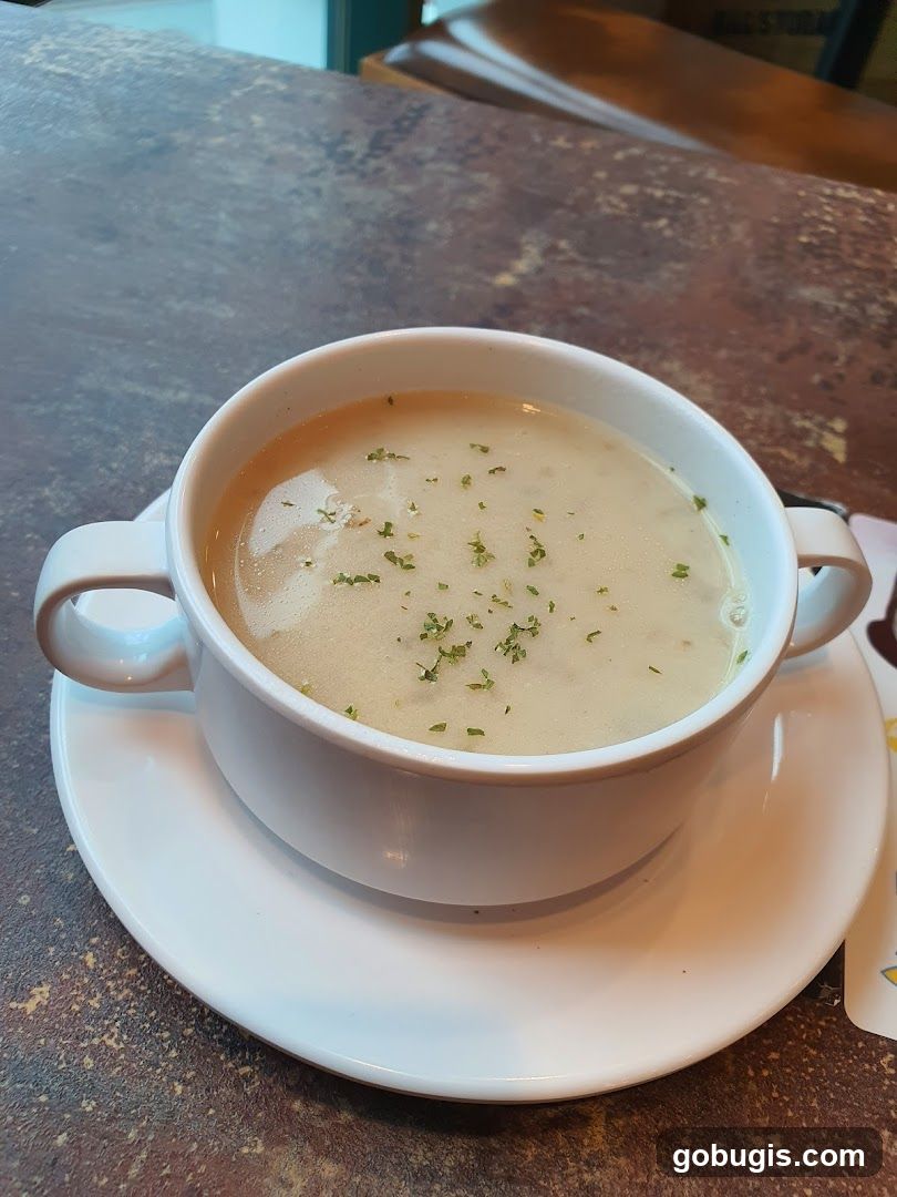 Creamy Soup with Parsley Garnish