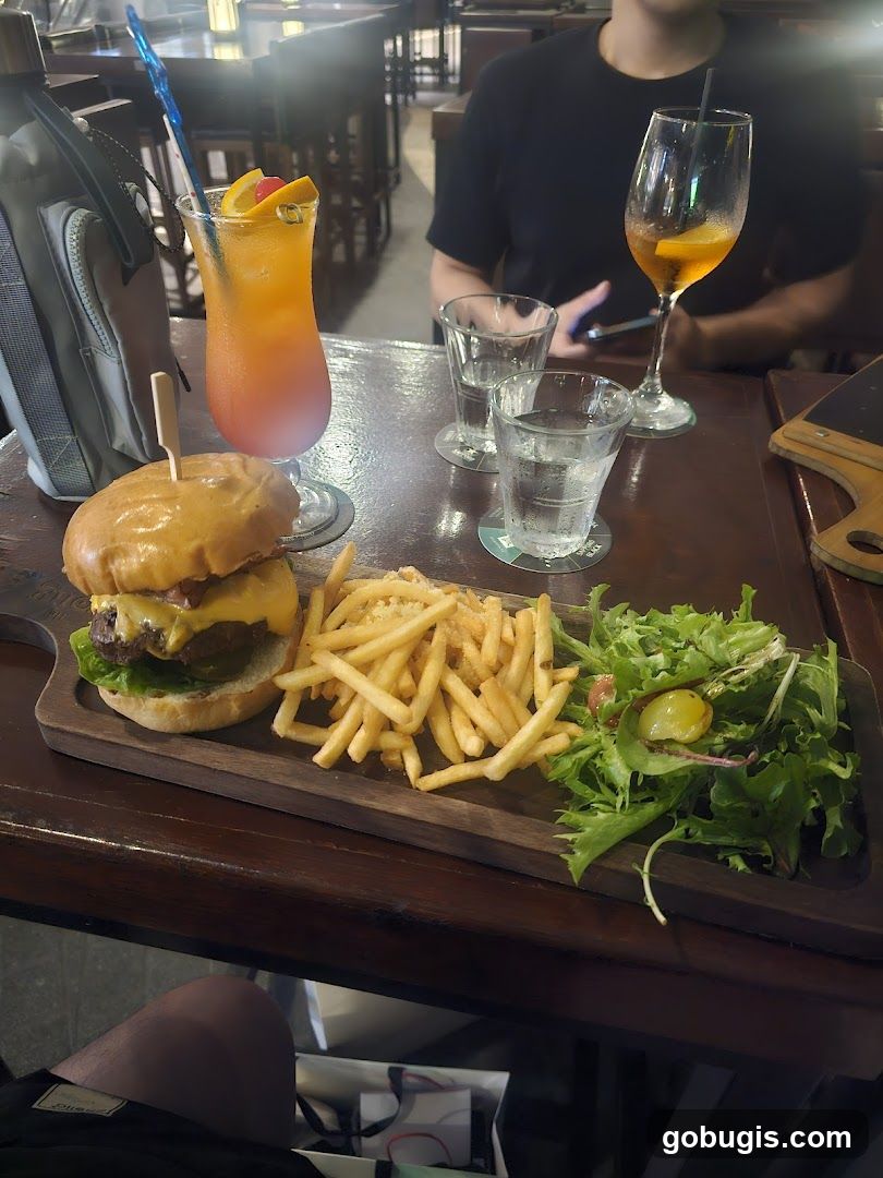 Burger, Fries, and Salad with Cocktails
