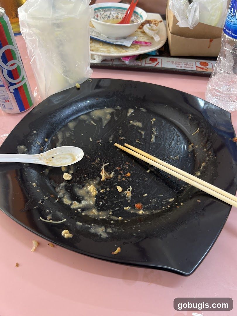 Dirty Plate with Chopsticks and Drinks