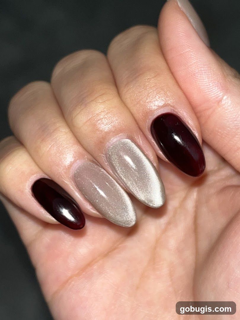 Nails with dark red and champagne polish