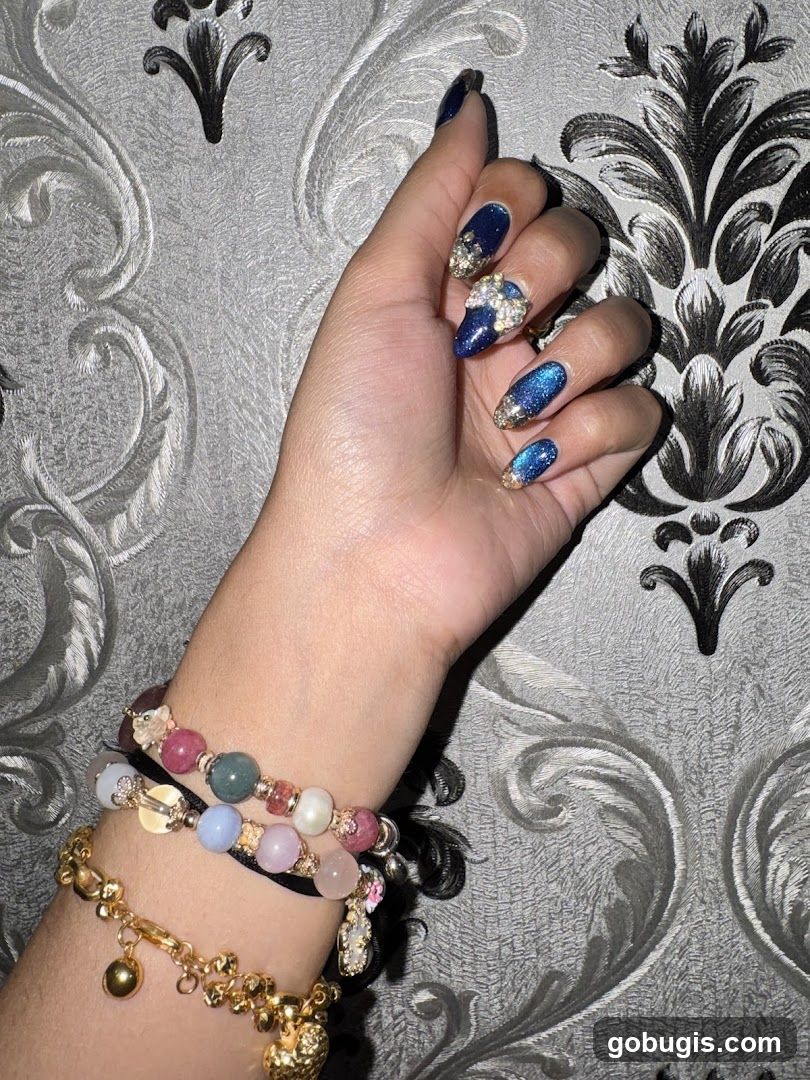 Hand with Decorated Nails and Bracelets