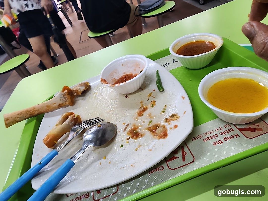 Messy plate with leftover food and sauces