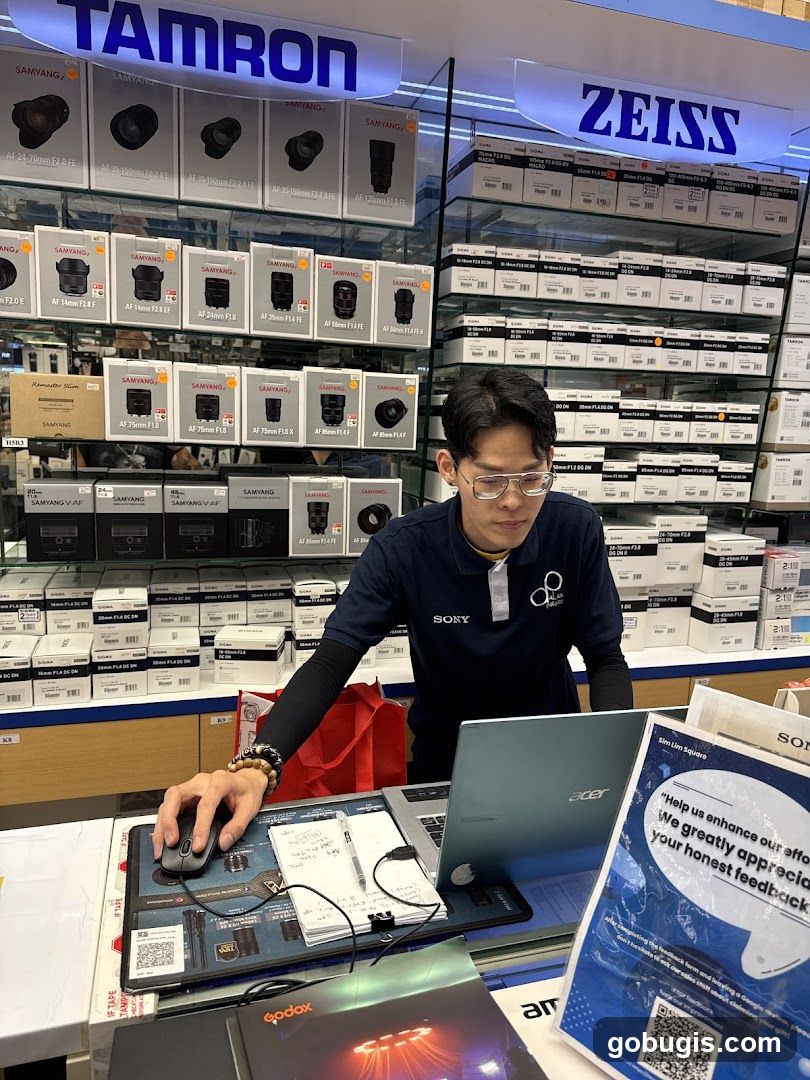 Camera Store Employee at Counter