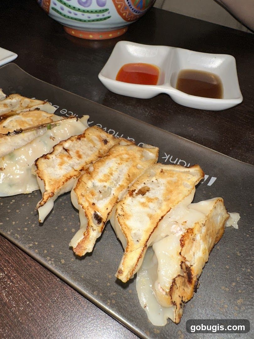 Pan-fried dumplings with dipping sauces