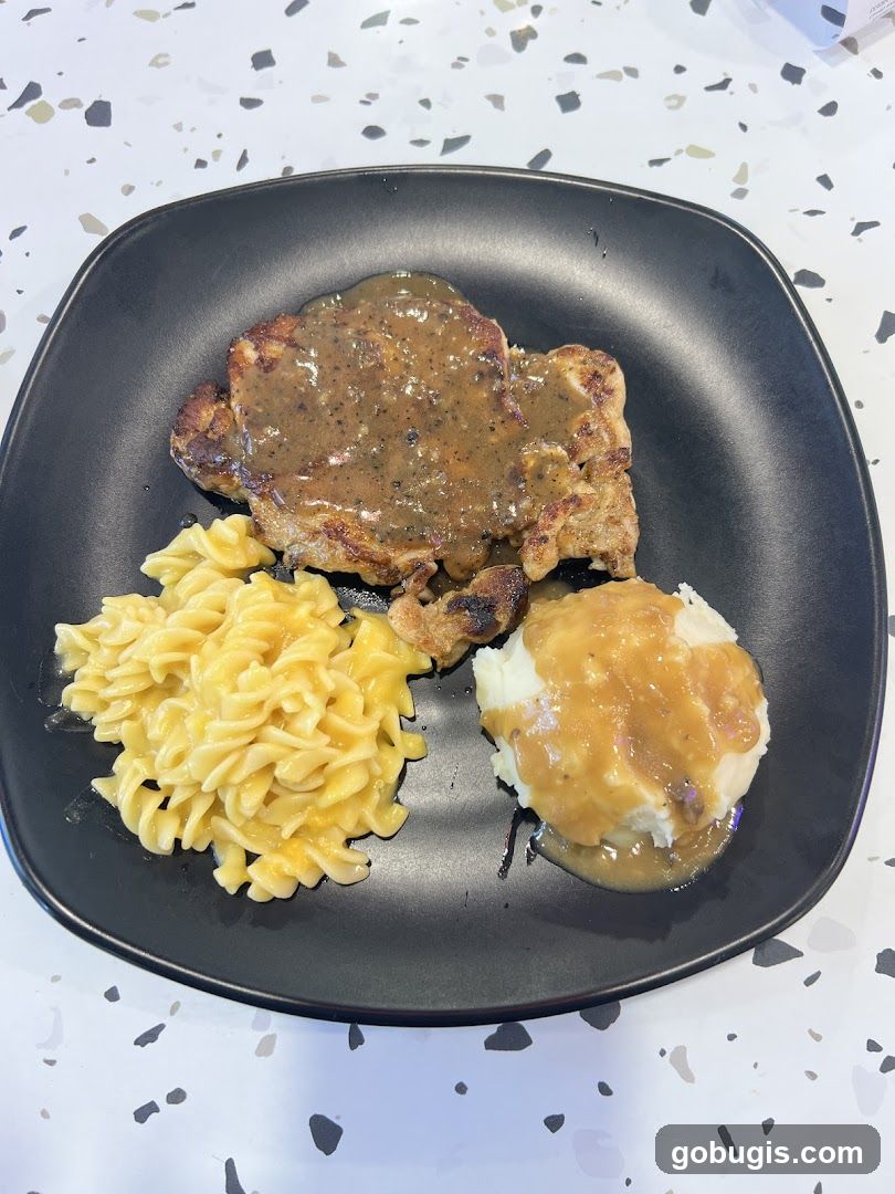 Chicken steak with pasta and mashed potatoes