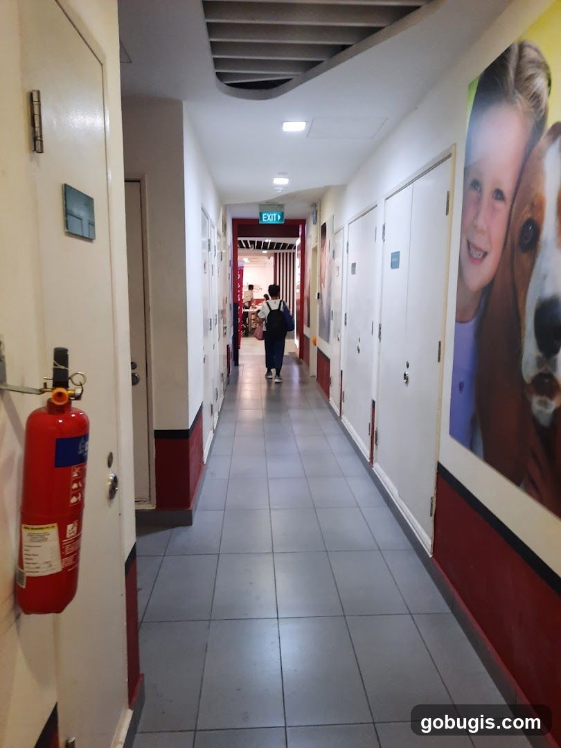 Hallway with artwork and fire extinguisher