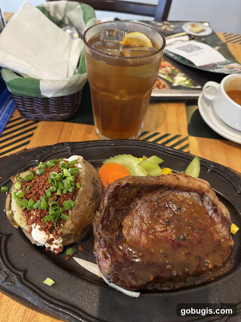 Steak Dinner with Baked Potato and Iced Tea