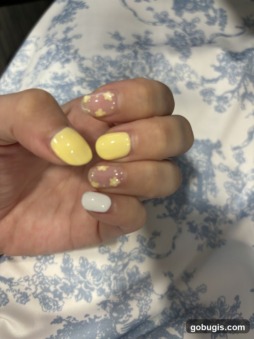 Yellow and White Nails with Floral Design