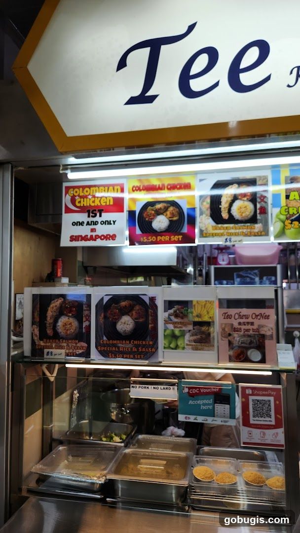 Food stall with Colombian chicken and other dishes