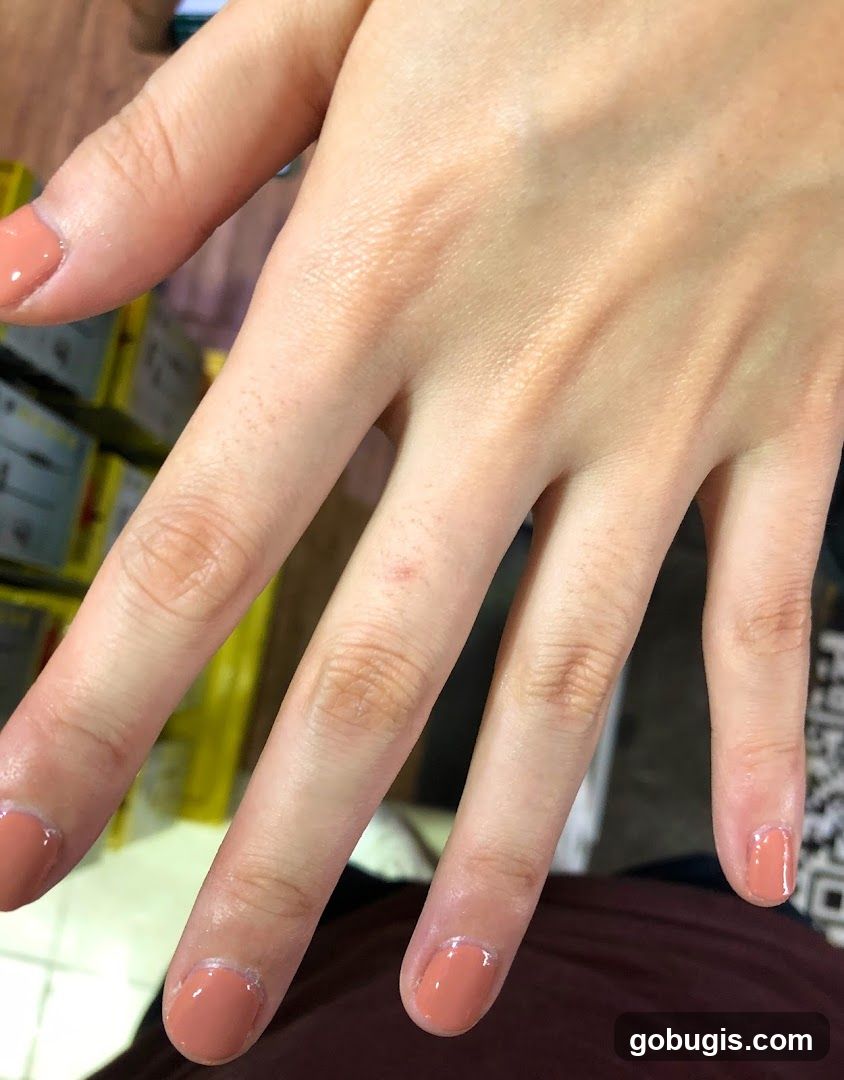 Close-up of a hand with freshly painted nails