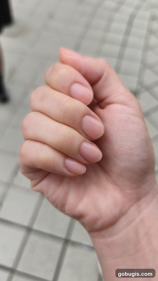 Close-up of a hand with natural nails