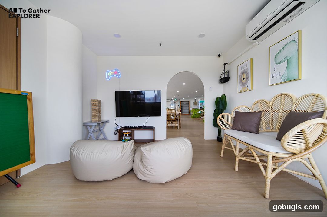 Cozy Lounge Area with Gaming and Art