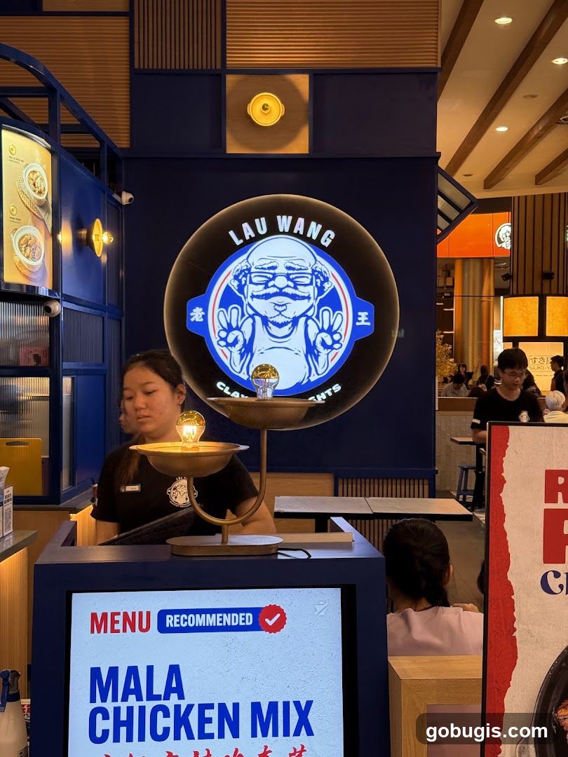 Restaurant Interior with Logo and Menu Display