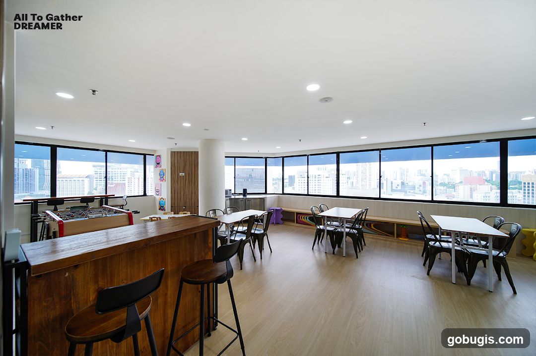 Indoor common area with tables and foosball table