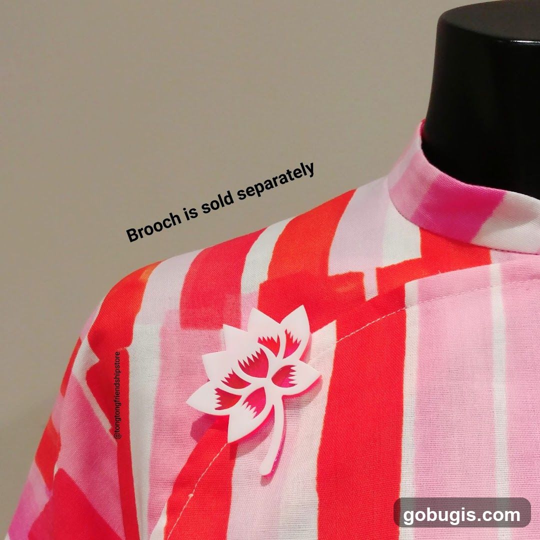 Brooch on striped garment