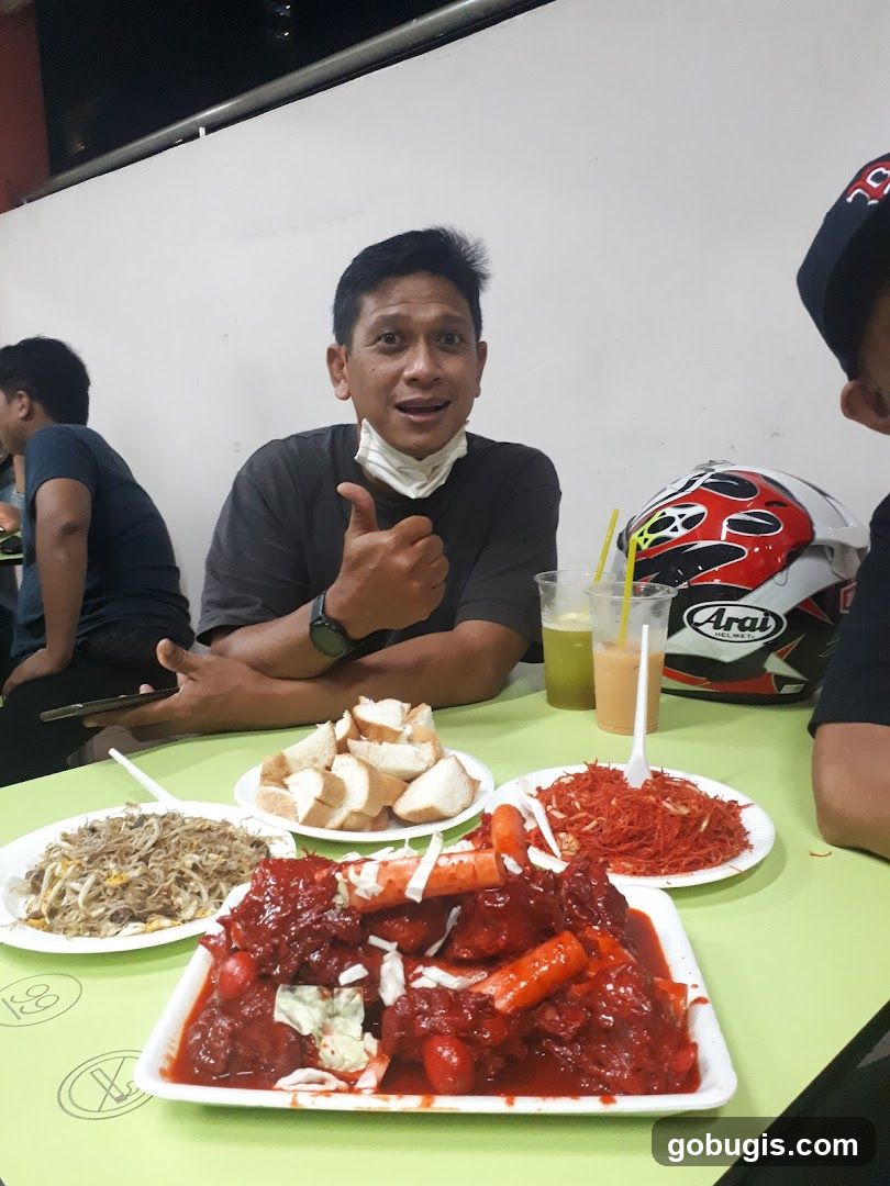 Man giving thumbs up with food