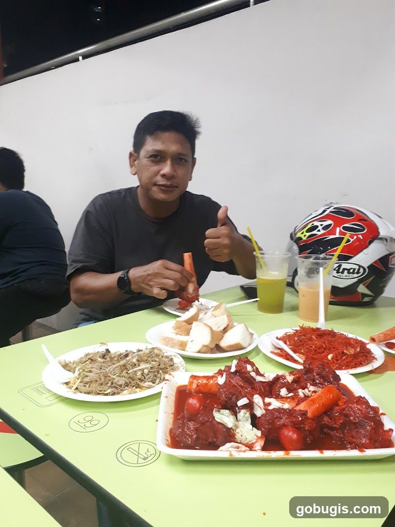 Man giving thumbs up with food