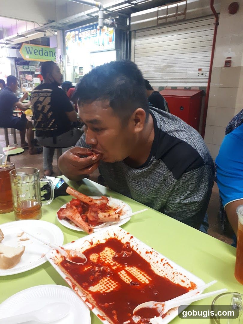 Man Eating Ribs
