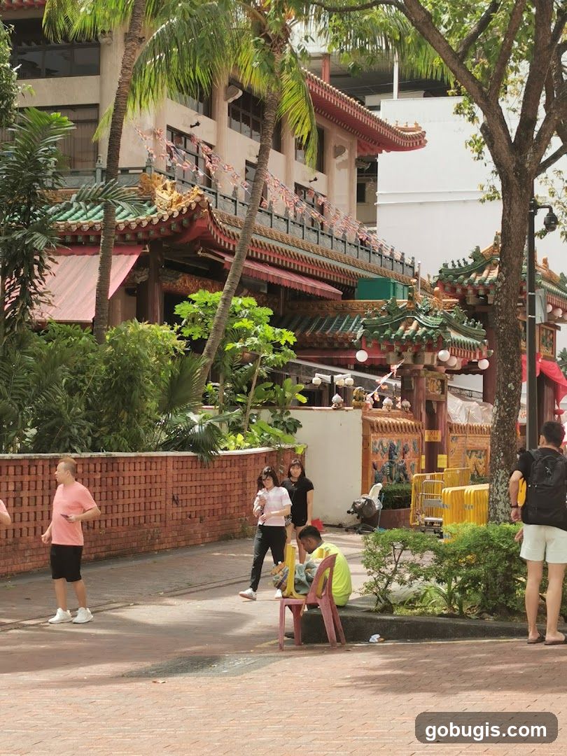 People walking past a temple entrance