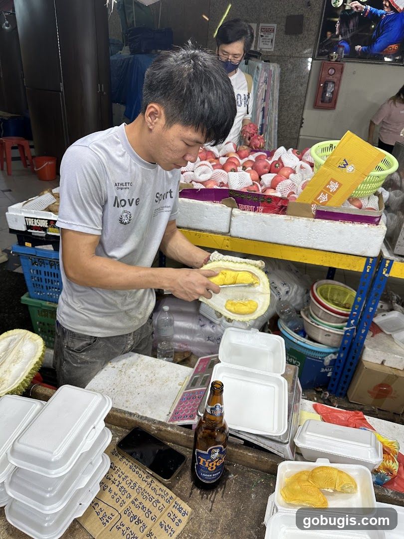 Fruit Vendor Preparing Durian