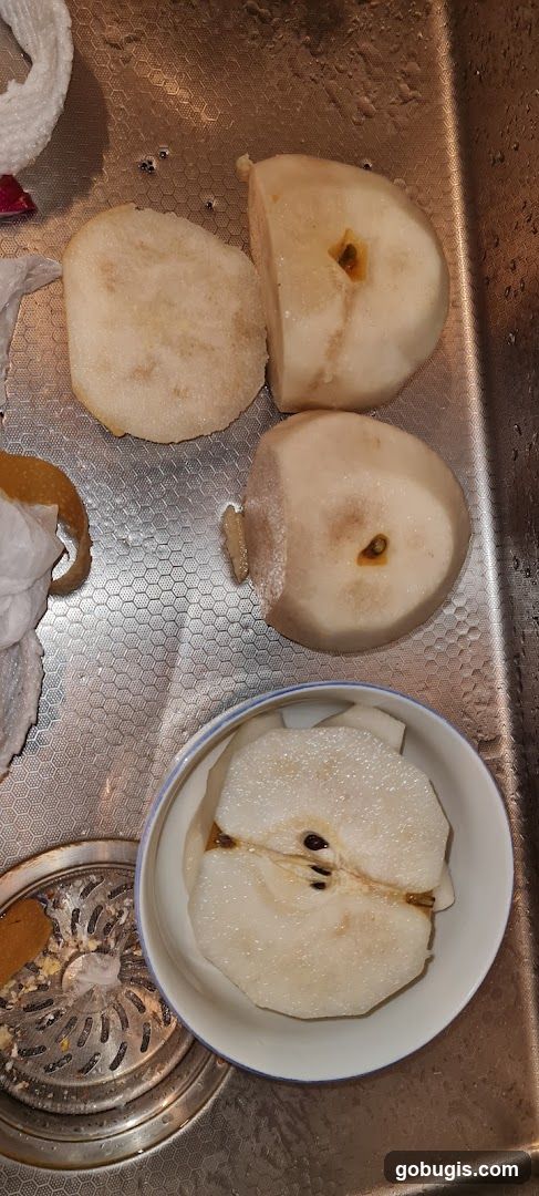 Sliced Pears in a Sink