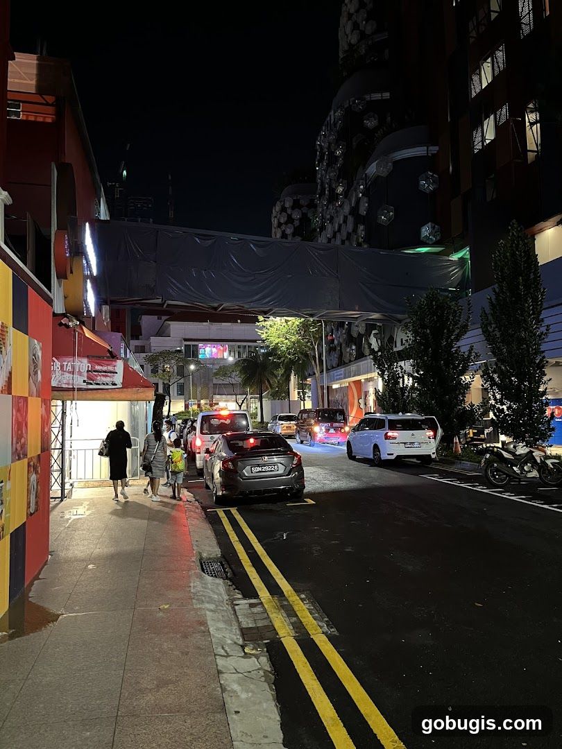 Nighttime Street Scene with Traffic and Buildings