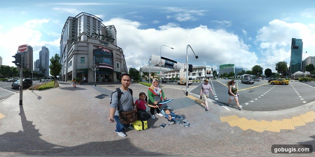 Family at a City Intersection