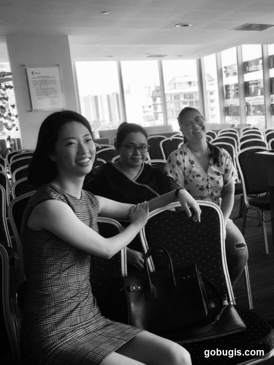 Three women sitting in chairs