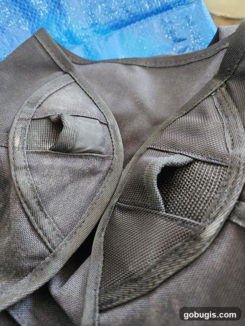 Close-up of black fabric straps and pockets