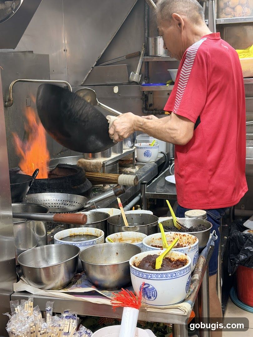 Chef cooking with a wok