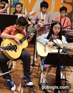 Children playing musical instruments