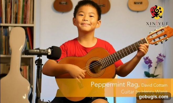 Young boy playing guitar