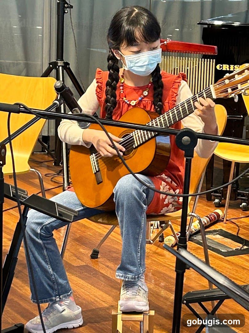 Young girl playing guitar