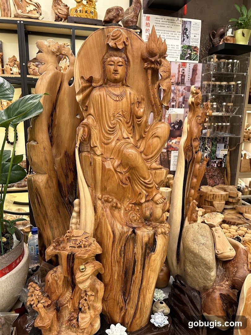 Wooden Sculpture of a Seated Figure