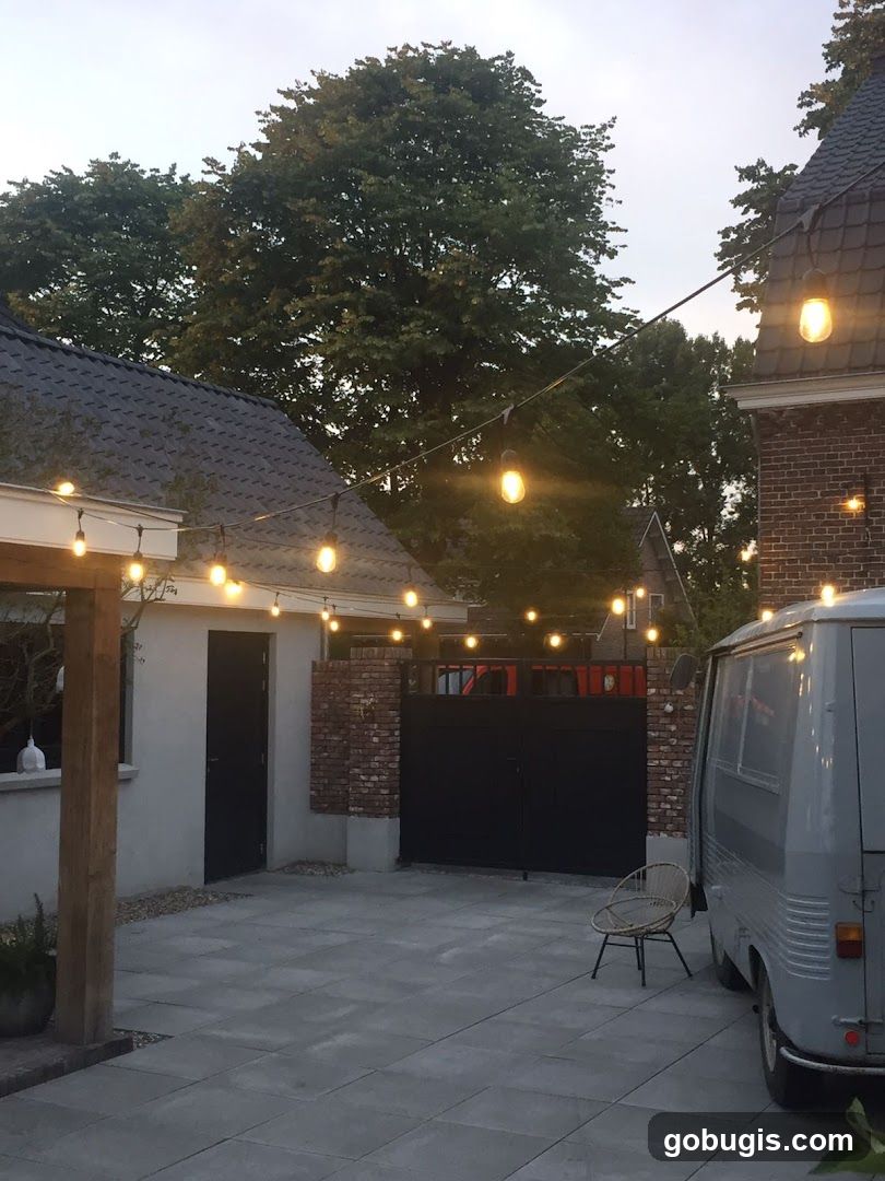 Outdoor patio with string lights and a van