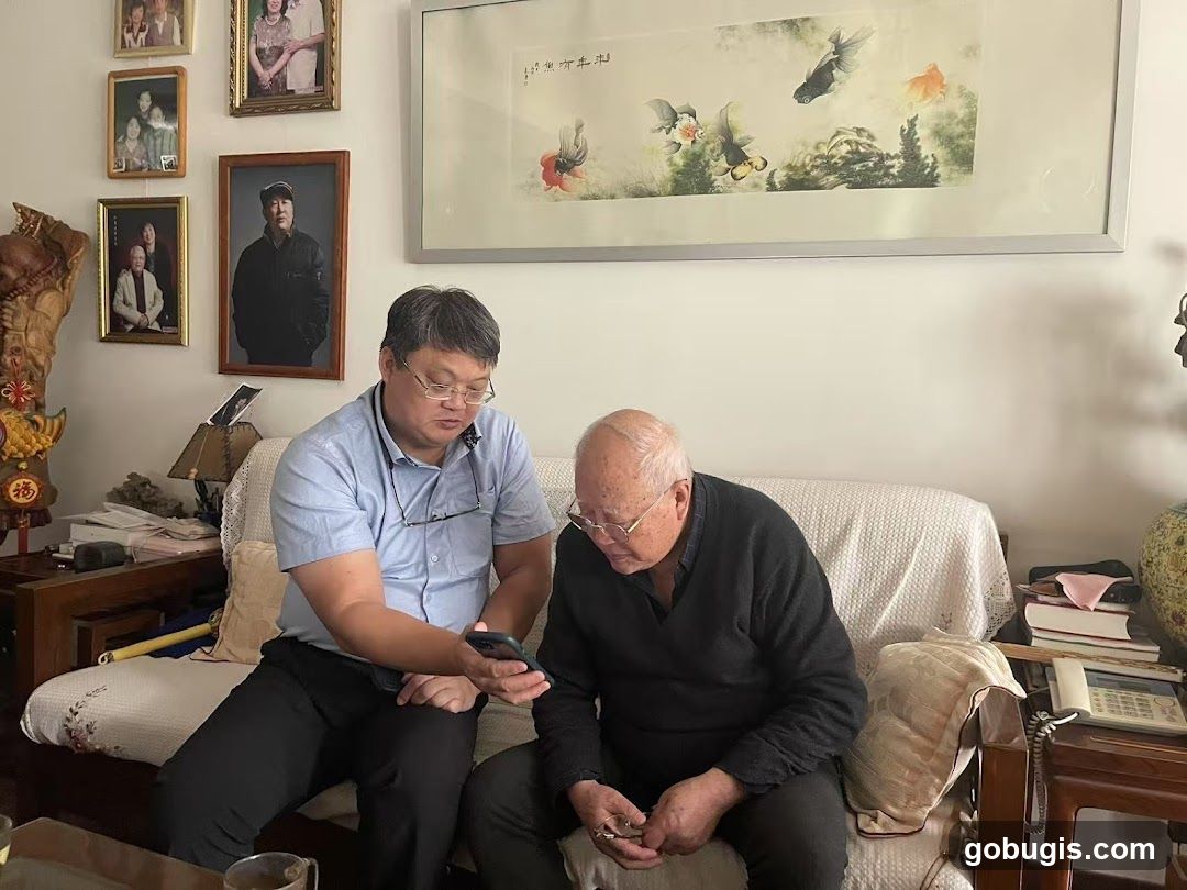 Two men looking at a phone