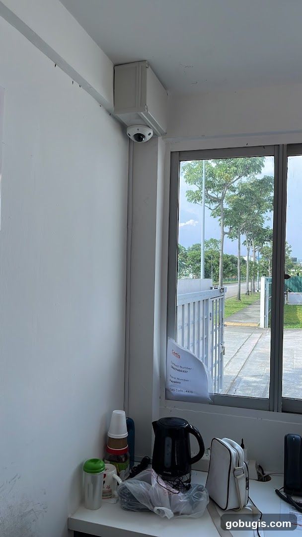 Office Desk with Kettle and Security Camera