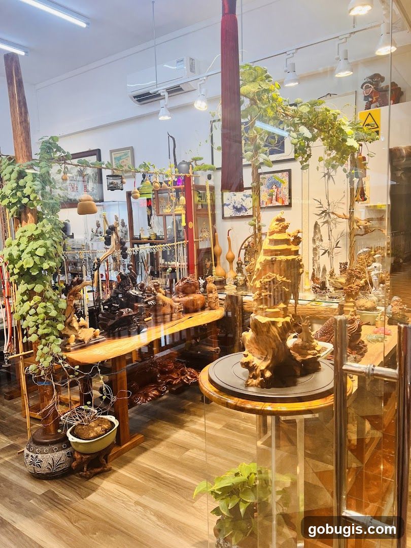 Interior of a shop with wooden sculptures and plants