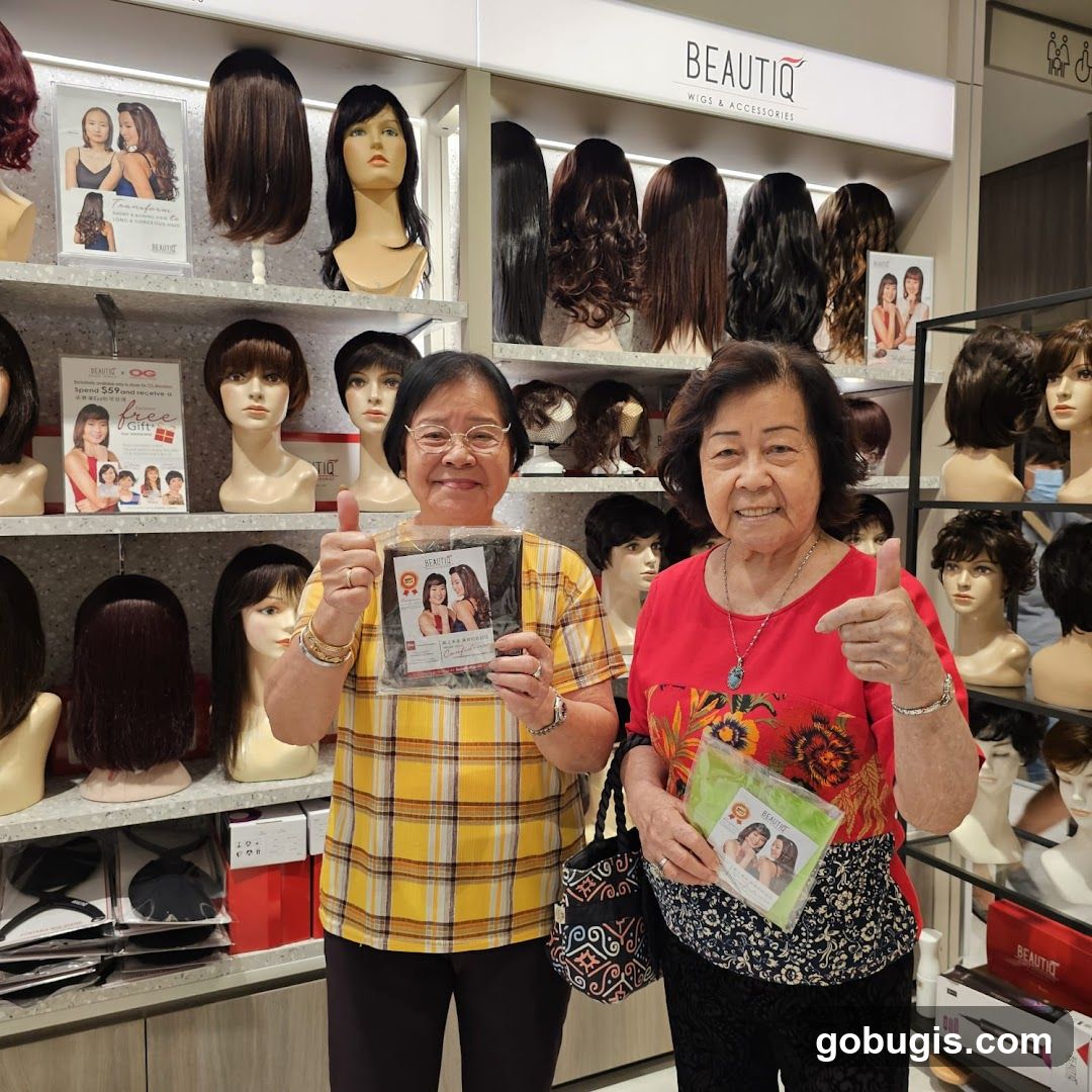 Two Women Posing with Wigs