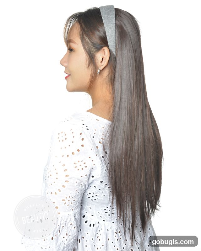 Woman with a gray headband and long brown hair